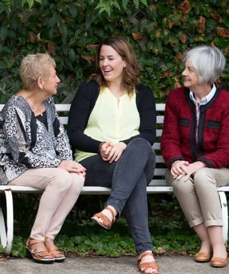 caregiver assisting elderly woman with dementia
