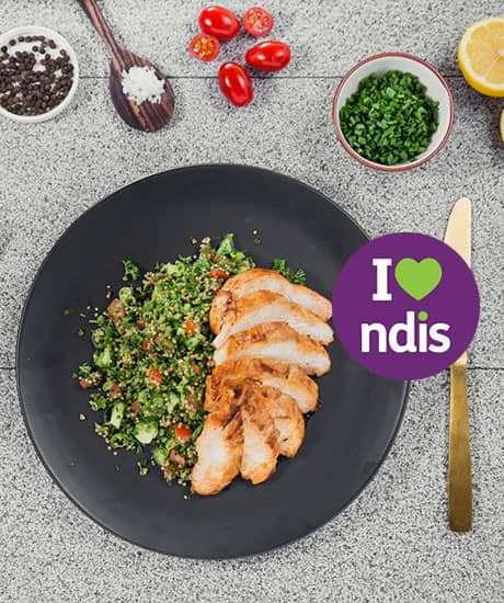 Caregiver preparing a nutritious meal for disabled people